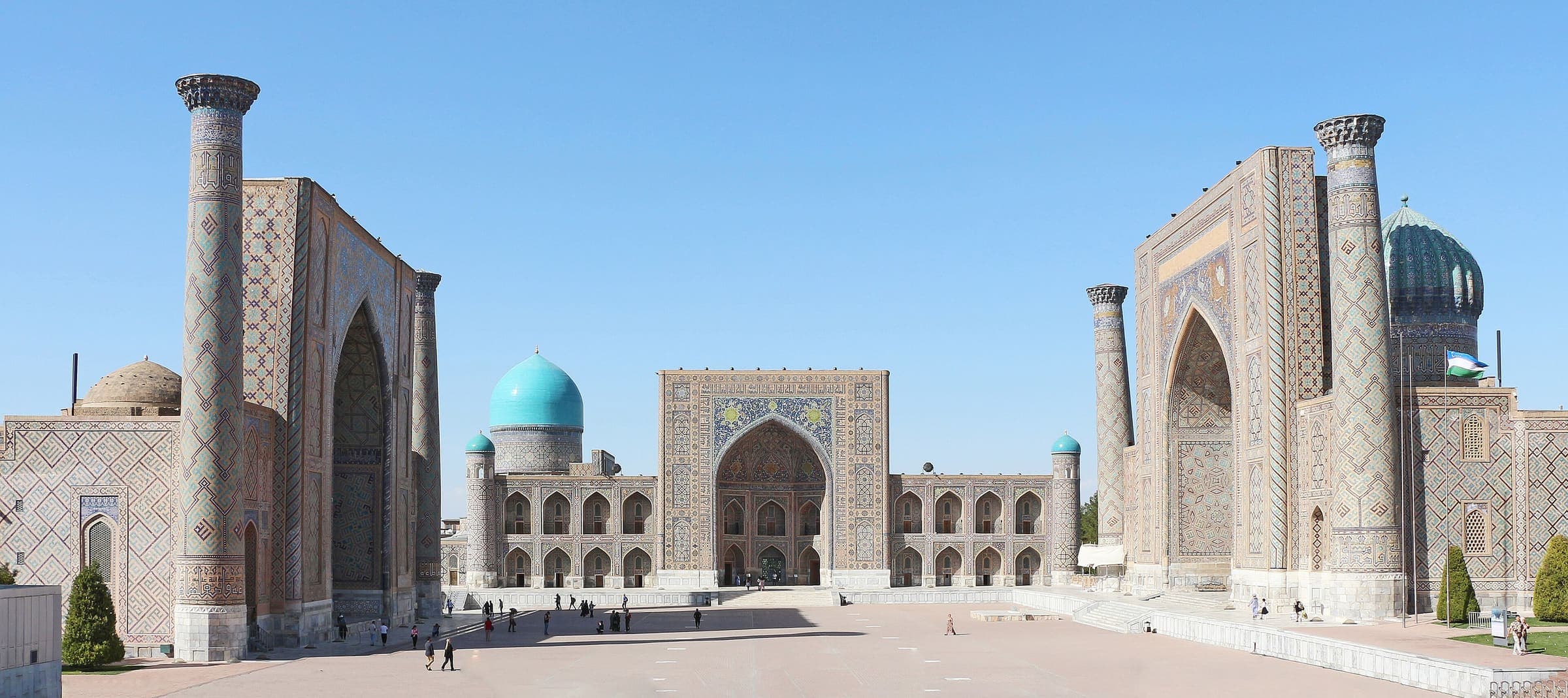The Registan in Samarkand: three tiled madrasas around a wide square